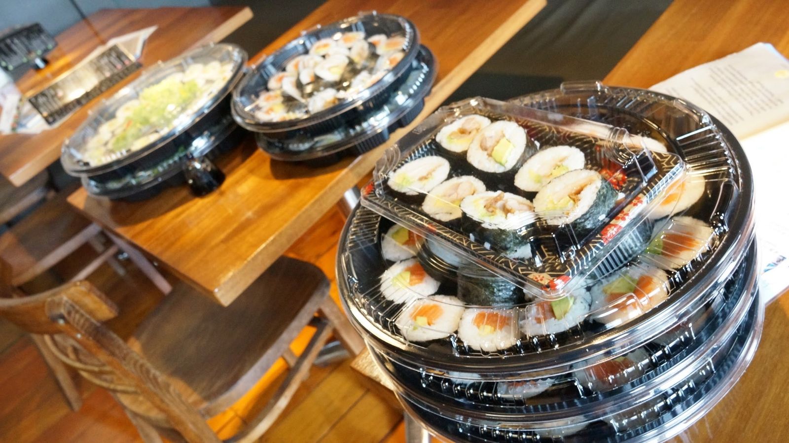 Sushi roll platters ready for takeaway